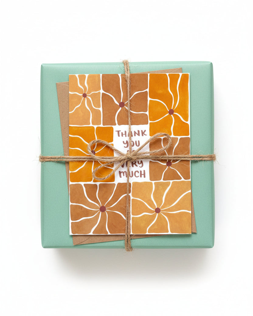 Greeting card with orange and brown floral pattern and 'Thank you so very much' text on a white background