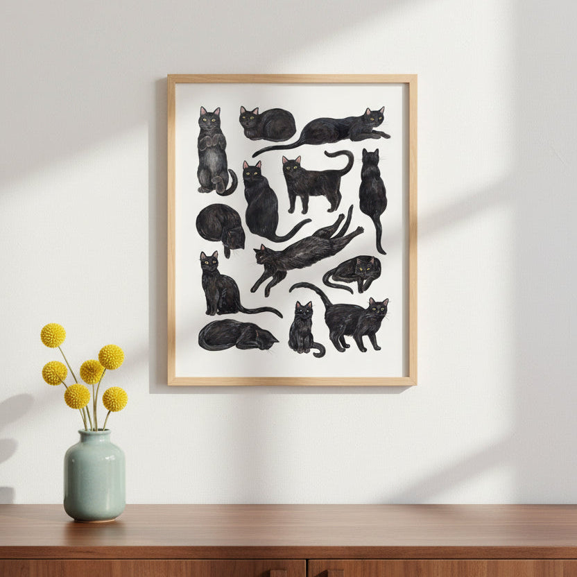 Illustrations of black cats in various poses on a white background